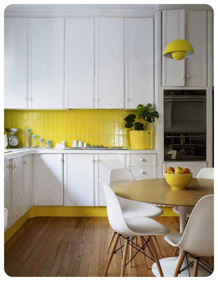 Yellow subway tiles as splashback in white kitchen
